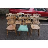 A set of six elm and beech kitchen chairs; together with one other similar.