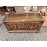 A small reproduction oak coffer, 95cm wide x 38cm deep x 46cm high.