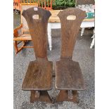 A pair of Arts & Crafts style chairs.