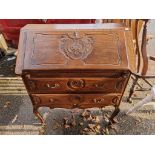 A continental carved oak bureau, 80cm wide x 43cm deep x 95cm high.