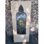 An old stained and leaded glass panel, mounted in old door, 193cm x 81cm.
