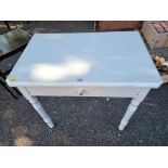 A white painted single drawer side table, 79cm wide x 49cm deep x 73cm high.