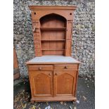 An oak dresser and rack, 97cm wide x 61cm deep x 197cm high.