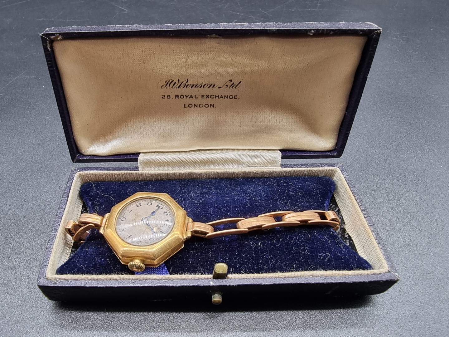 A vintage '18c' gold ladies wristwatch, by J W Benson, on yellow metal expanding bracelet