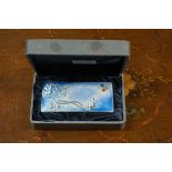 A boxed silver and enamel rectangular box and cover, by C J, stamped 'Silver 990', 9cm wide.