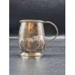 An Arts & Crafts silver Christening mug, by Amy Sandheim, London 1925, 9cm high, 206g.
