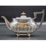 An Edwardian silver teapot, by Walker & Hall, Sheffield 1902, 537g all in, 16cm high.