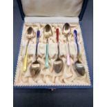 A cased set of six Norwegian silver gilt and coloured enamel coffee spoons, stamped '925', in