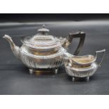 A Victorian silver teapot and matching cream jug, by Thomas Bradbury & Sons, London 1881, 579g all