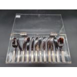 A cased set of ten tortoiseshell caviar knives and two spoons, stamped 'A W 925', each knife 14.
