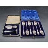 A cased set of six silver teaspoons, Sheffield 1912; together with a cased silver spoon and