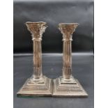 A pair of Edwardian silver Corinthian column candlesticks, by Thomas Hayes, Birmingham 1902, 20cm