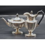 An Edwardian silver teapot and matching hot water jug, by Thomas Bradbury & Sons, London 1905/6,