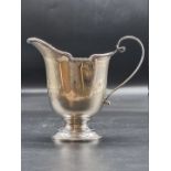 A silver milk jug, by A & J Zimmerman Ltd., Birmingham 1925, 139g 12cm high.
