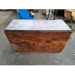 An antique mahogany dropleaf table, 107cm wide x 72cm high.