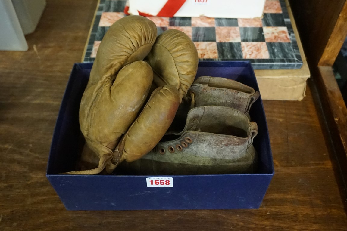 An antique pair of child's leather rugby boots; together with a similar pair of boxing gloves.