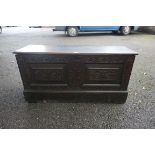 An antique oak coffer, 111cm wide x 38cm deep x 55.5cm high.