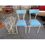 A pair of industrial kitchen chairs.