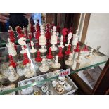 A late 19th century bone chess set, red stained and natural, king 9.3cm high, pawn 3.3cm high, (