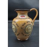 An unusual Victorian Doulton Lambeth stoneware jug, 19cm high.
