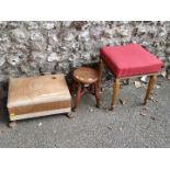An antique giltwood and upholstered stool; together with another stool, having gilt brass feet;