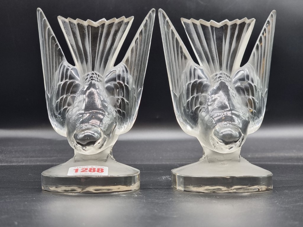 A pair of Lalique 'Hirondelle' clear and frosted glass bookends, 19cm high.