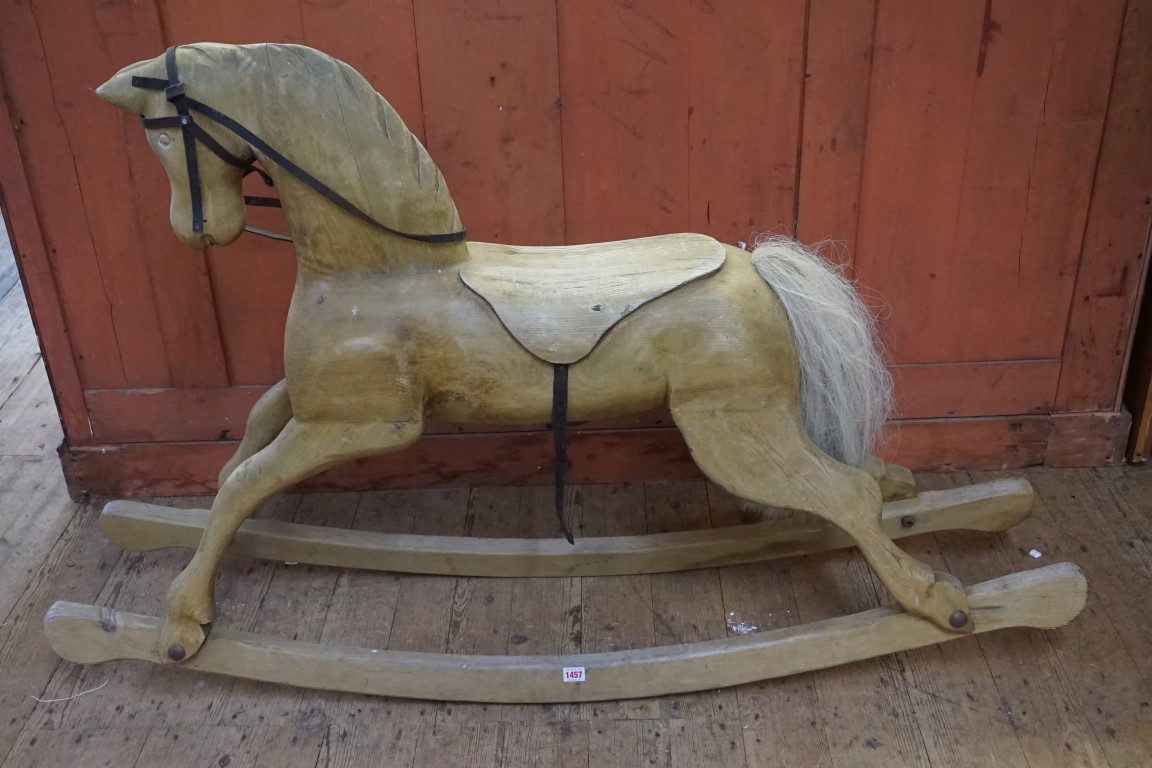 An antique Folk Art style rocking horse, 150cm long.