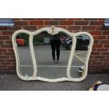 A modern overmantel mirror, with gilt decoration, 130cm wide.