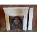 A cast iron fire surround, 116cm wide x 124cm high; together with a matching fireplace.