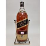 A 4.5 litre bottle of Johnny Walker 'Black Label' blended whisky, in cradle.