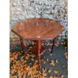 A mahogany hexagonal table, 74cm wide x 76cm high.