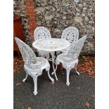 A white painted aluminium garden table; together with four matching chairs.