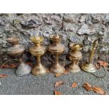 Four old oil lamps; together with a table lamp.