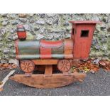 A child's painted wood rocking train, 80cm wide.