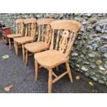 A set of four beech kitchen chairs.