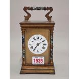 An antique gilt brass and champleve enamel carriage clock, striking on a gong, height including