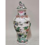 A Chinese famille verte inverted baluster vase and cover, Qianlong six character mark to base,