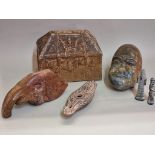 A mixed group of items, to include: a carved soapstone head; a pottery casket; a Roman style oil