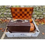 Three old leather cases; together with a chess set and board.