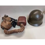 A US military helmet; together with a British gas mask. (2)