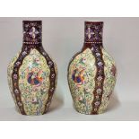 A pair of Islamic style opaque glass vases, enamelled with phoenixes and stylized flowers, 23cm