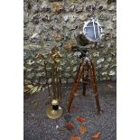 A tripod stage light style lamp; together with a set of brass fireside tools.