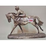 A silver skinned group of a horse and jockey, 26.5cm long, (the detached jockey a.f.).