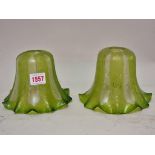 A pair of Edwardian etched green glass light shades, 11cm high.