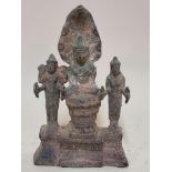 A Khmer bronze triad figure group, probably 12th/13th century, 16cm high.