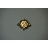 Coins: an Elizabeth II 1982 gold half sovereign, in 9ct gold brooch mount, gross weight 8.3g.
