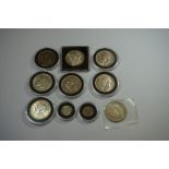 Coins: ten George V silver coins, comprising eight half crowns and two threepenny bits.