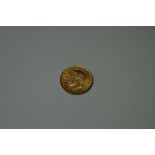 Coins: a George V 1914 gold half sovereign.