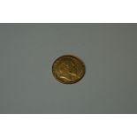 Coins: an Edward VII 1903 gold half sovereign.