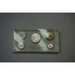 Coins: a 'The Bank Of Adelaide Centenary 1865-1965' paperweight, inset five coins.